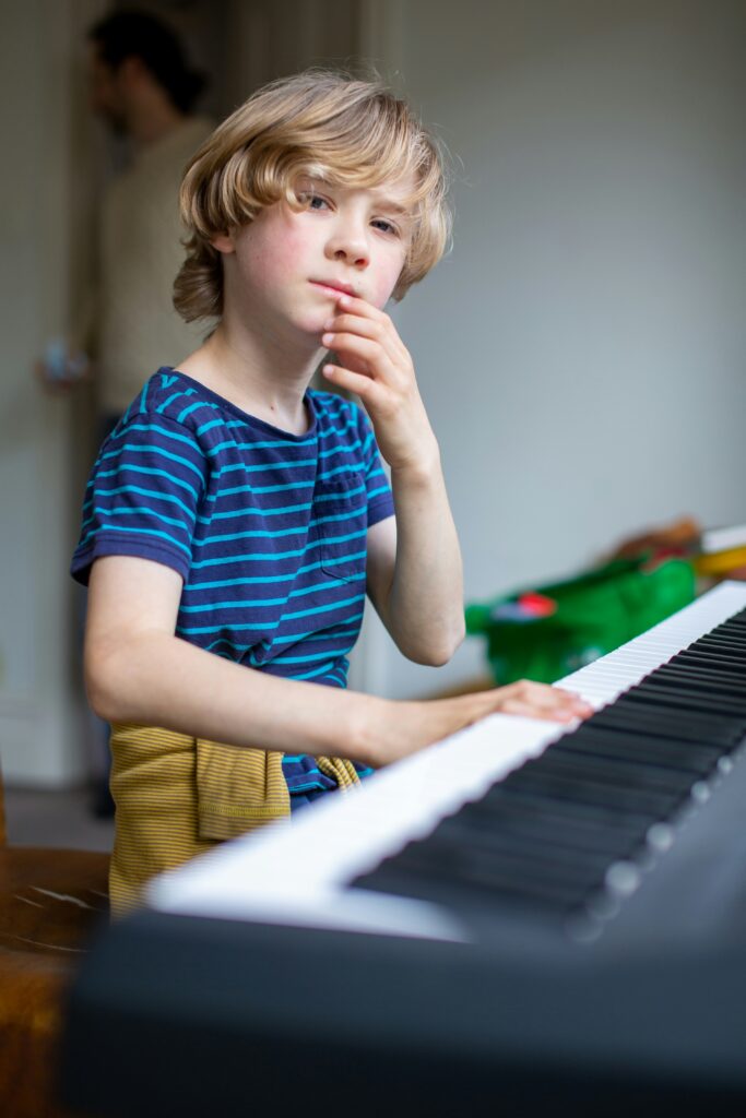 Student contemplating structured piano practice.