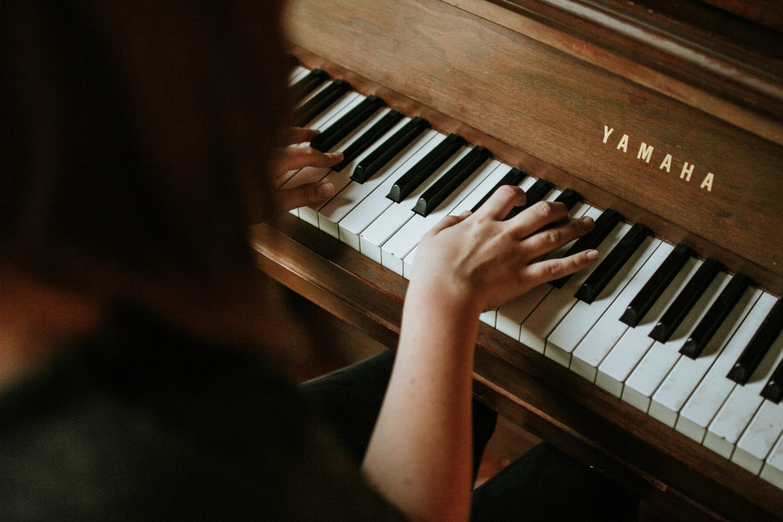 Pianist practicing piano with small hands.